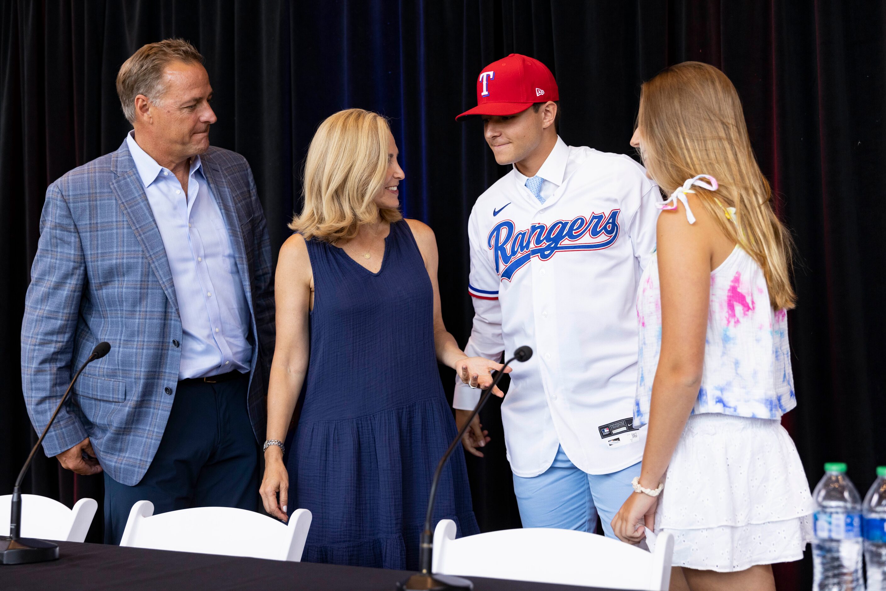 Jack Leiter (left) from Vanderbilt University chats with his family following a press...