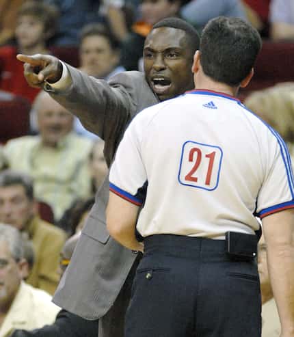 FILE - Mavericks coach Avery Johnson displays his displeasure with referee Tim Donaghy (21),...