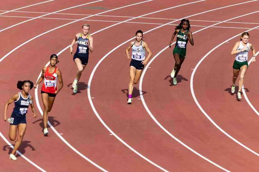 Samantha Humphries of Flower Mound, center, races in the girls’ 800-meter final at the UIL...