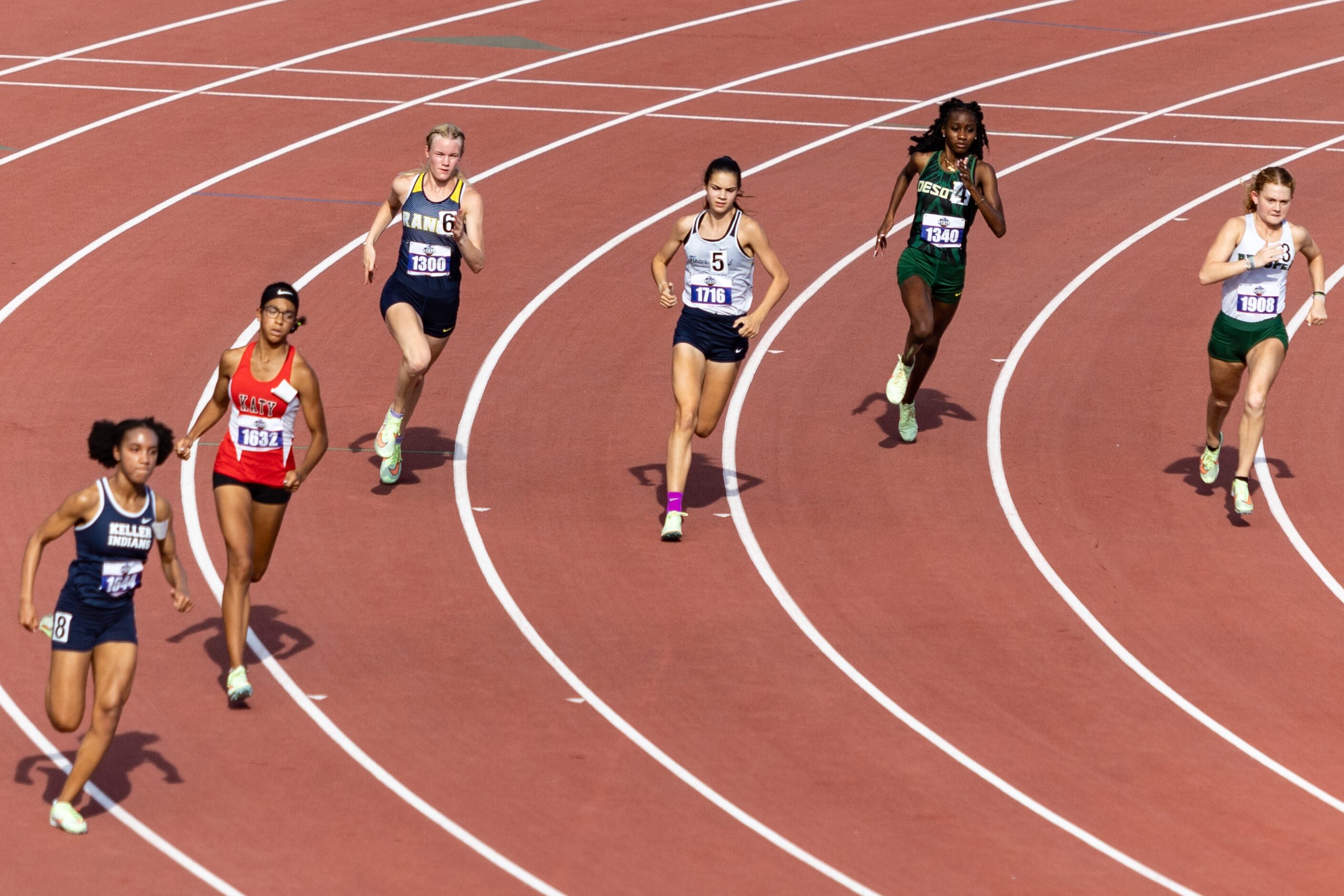 Samantha Humphries of Flower Mound, center, races in the girls’ 800-meter final at the UIL...