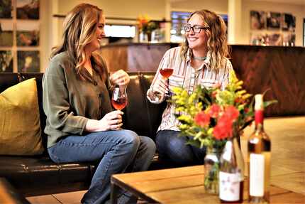 two women enjoy a wine tasting