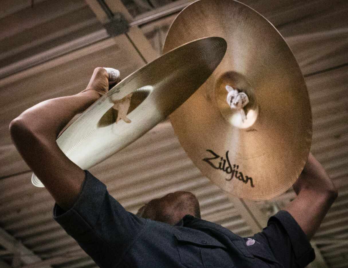 Darrquon Threlkeld, 18, practices the cymbals with  the Dallas Mass Band at the Braswell...