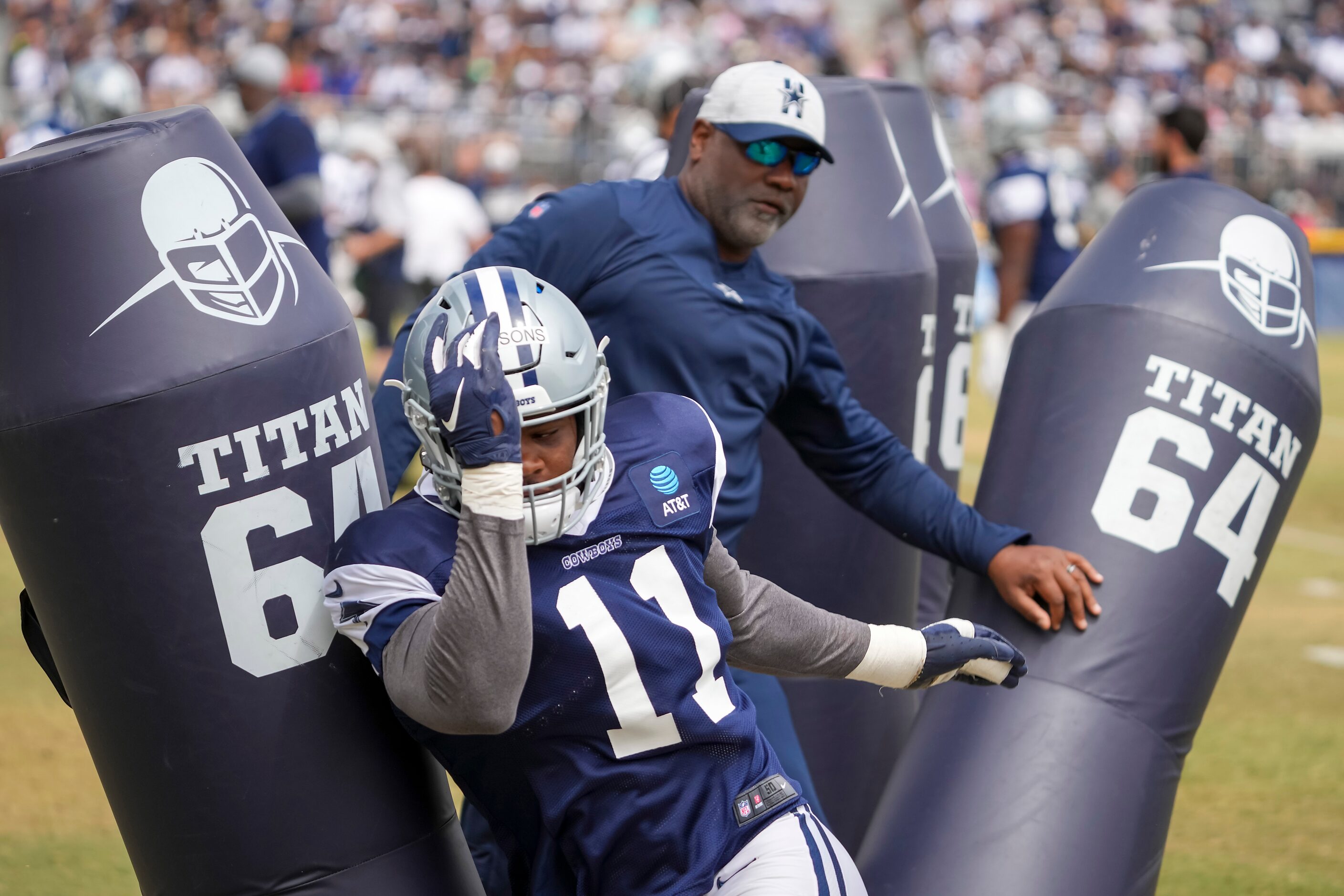 Dallas Cowboys linebacker Micah Parsons (11) runs a drill during a practice at training camp...