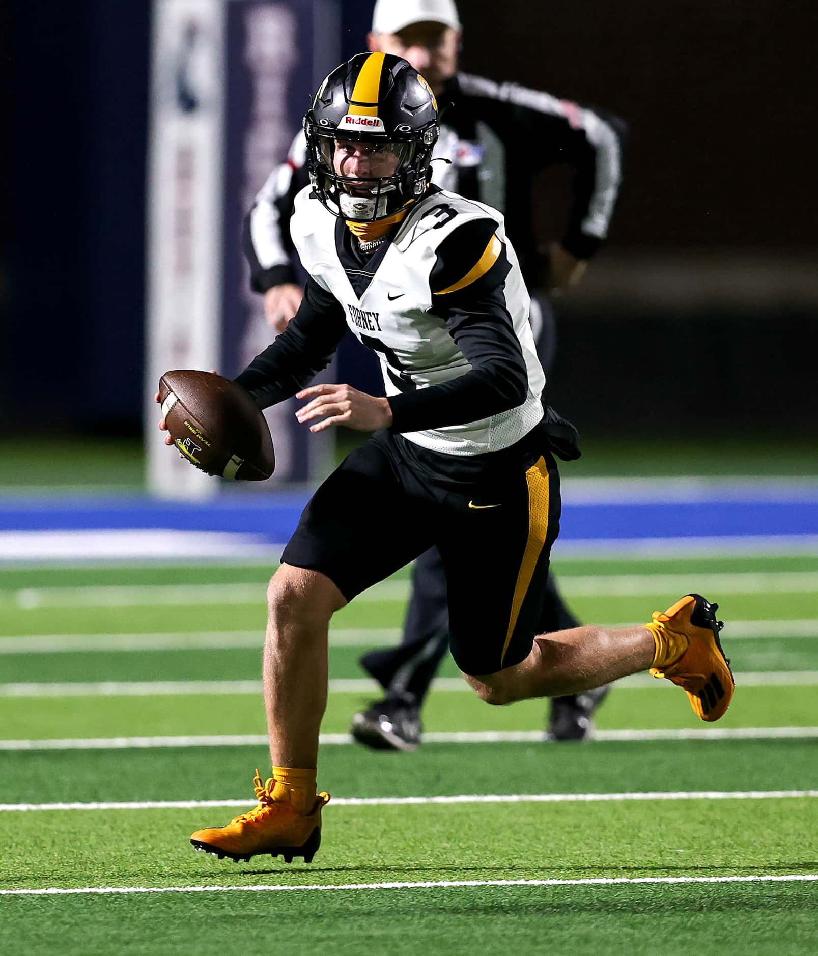 Forney quarterback Kyle Crawford rolls out against Richland during the first half of the...