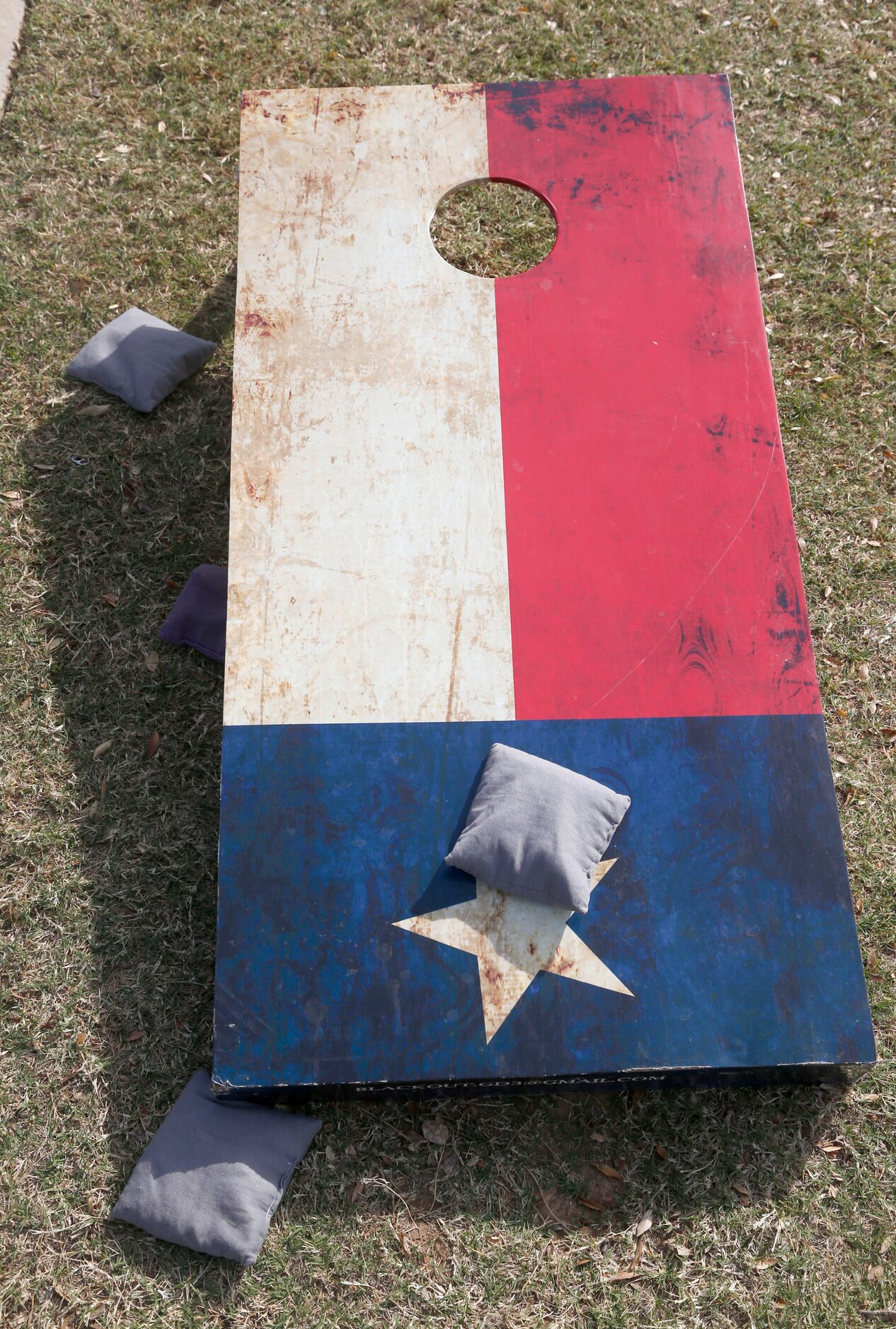 A corn hole game board marked like the Flag of Texas prior to the Dallas Cowboys-Washington...