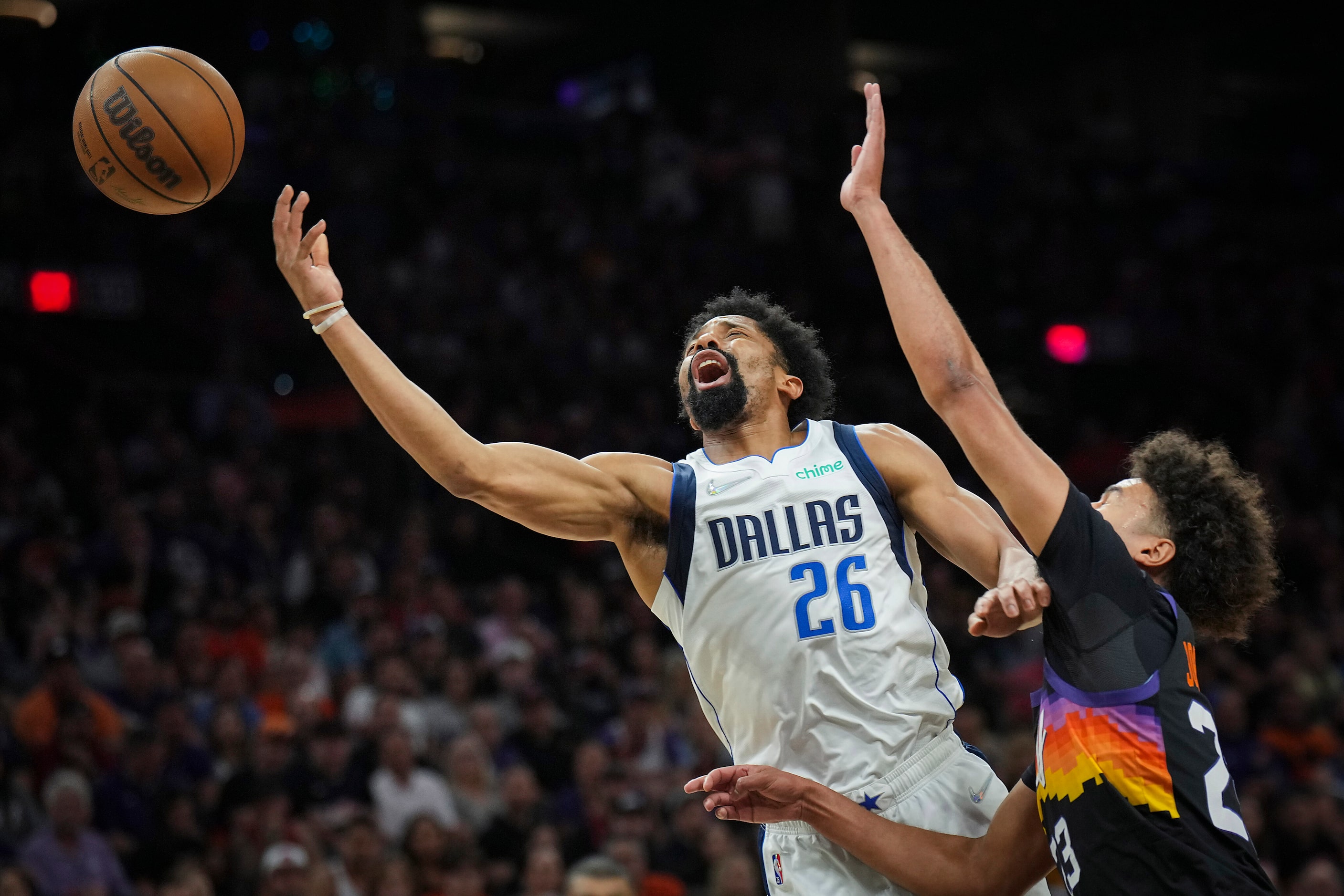 Dallas Mavericks guard Spencer Dinwiddie (26) is fouled by Phoenix Suns forward Cameron...