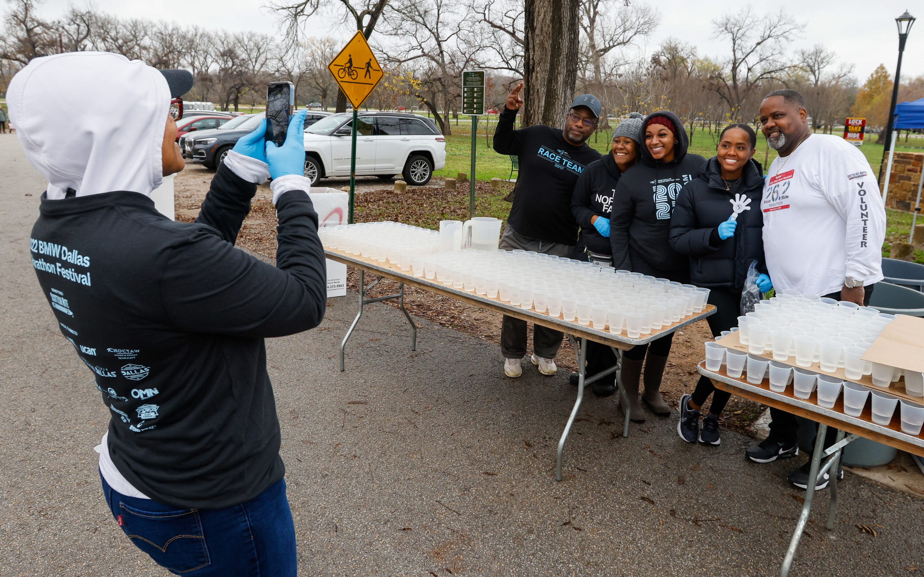 Cliff Piper (right) poses with his team at the 17-mile water station for the BMW Dallas...