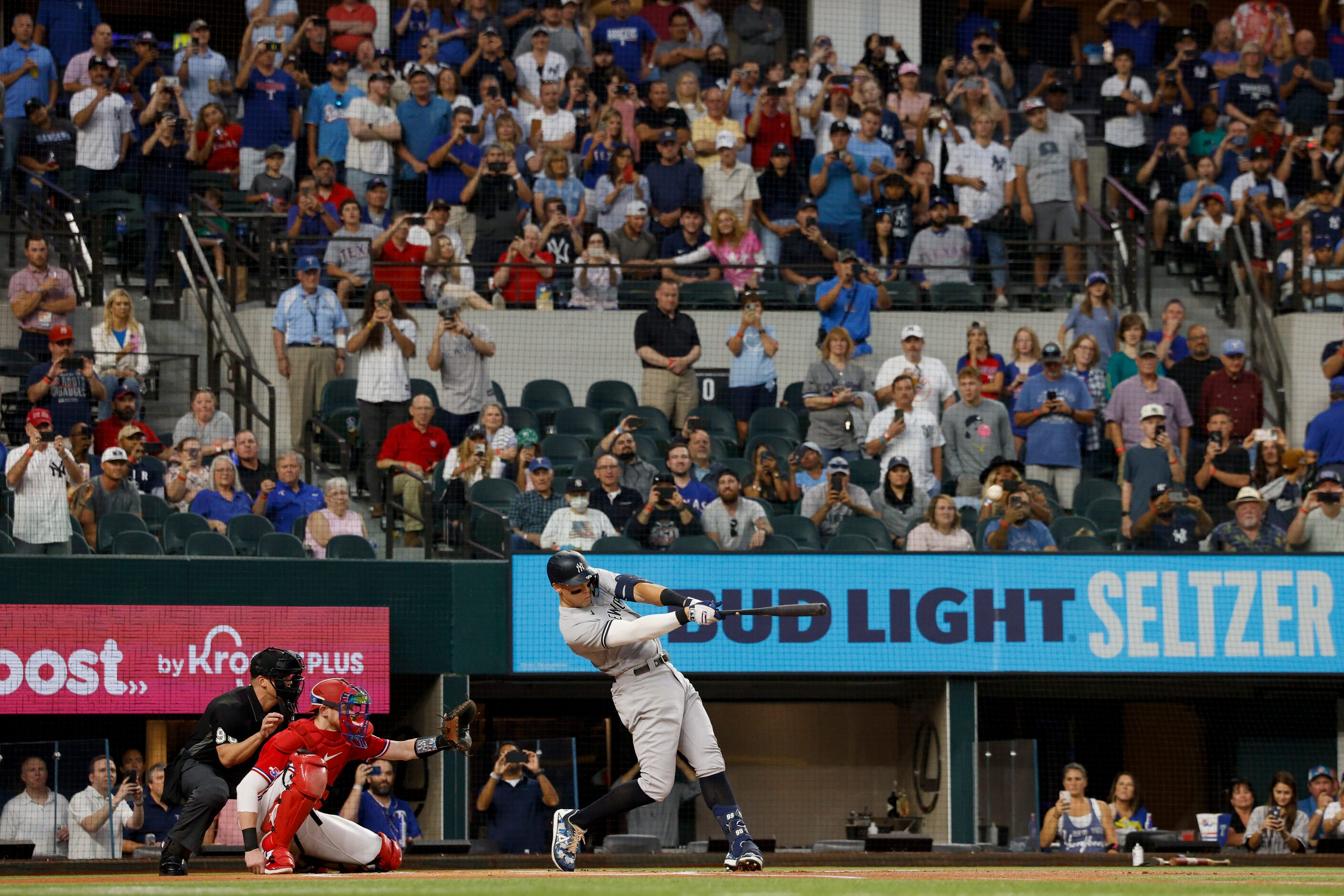 New York Yankees right fielder Aaron Judge (99) hits a home run to left field off Texas...