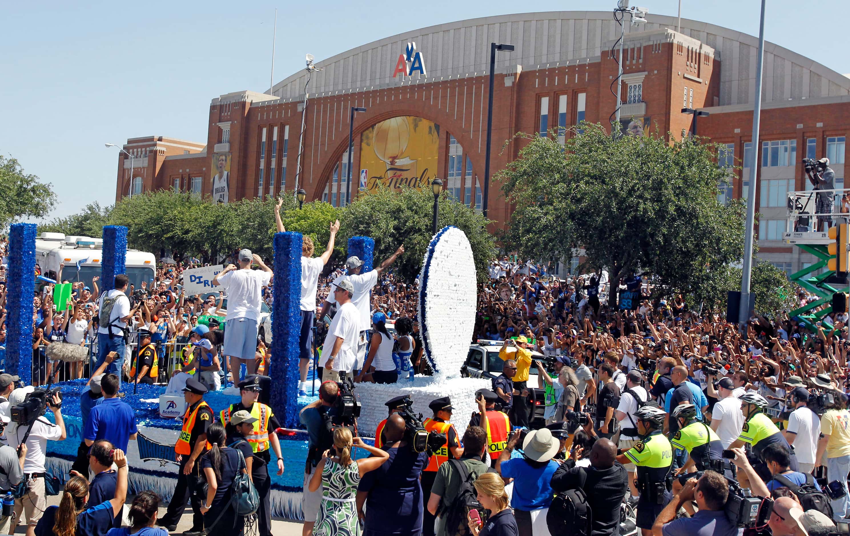 A float carrying Jason Kidd, Dirk Nowitzki and Jason terry passes in front of the American...