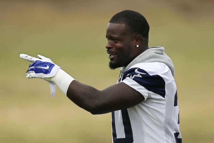 Dallas Cowboys running back Christine Michael gestures to teammates during practice...