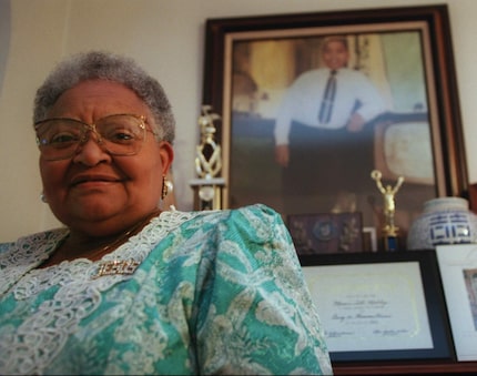  Mamie Till-Mobley stands before a portrait of her slain son, Emmett Till, in her Chicago...