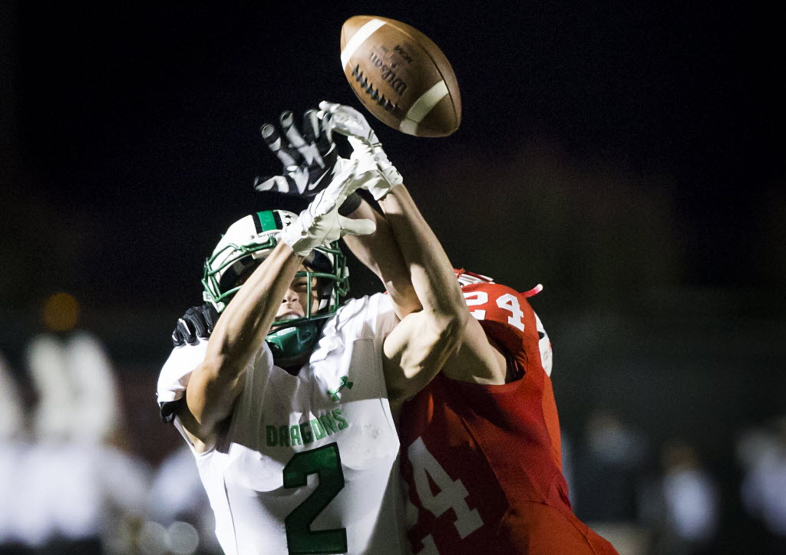 Coppell defensive back T.J. Mcdaniel (24) breaks up a pass intended for Southlake Carroll...