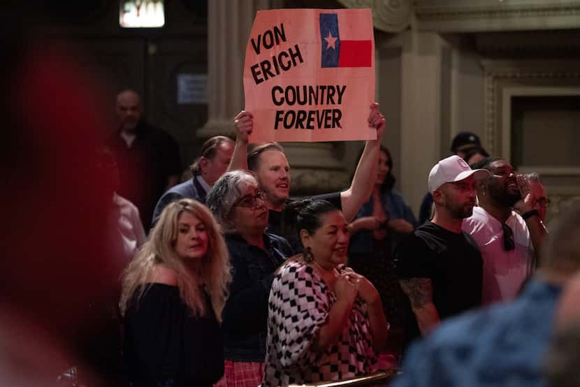 A wrestling fan holds a sign in support of pro wrestling legend Kevin Von Erich.