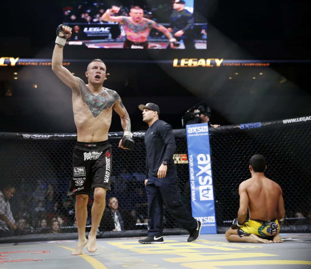 Steven Peterson celebrates after beating Caio Machado by submission during Legacy Fighting...