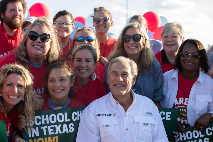 Governor Greg Abbott (center) hosts a tailgate at the First Dallas Academy football game at...