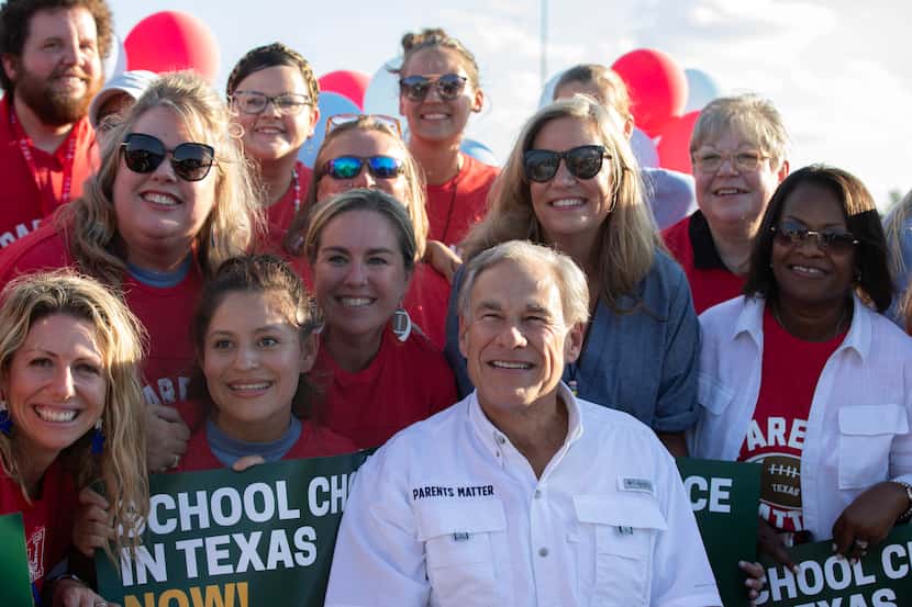 Gov. Greg Abbott (center) hosts a tailgate at the First Dallas Academy football game at the...
