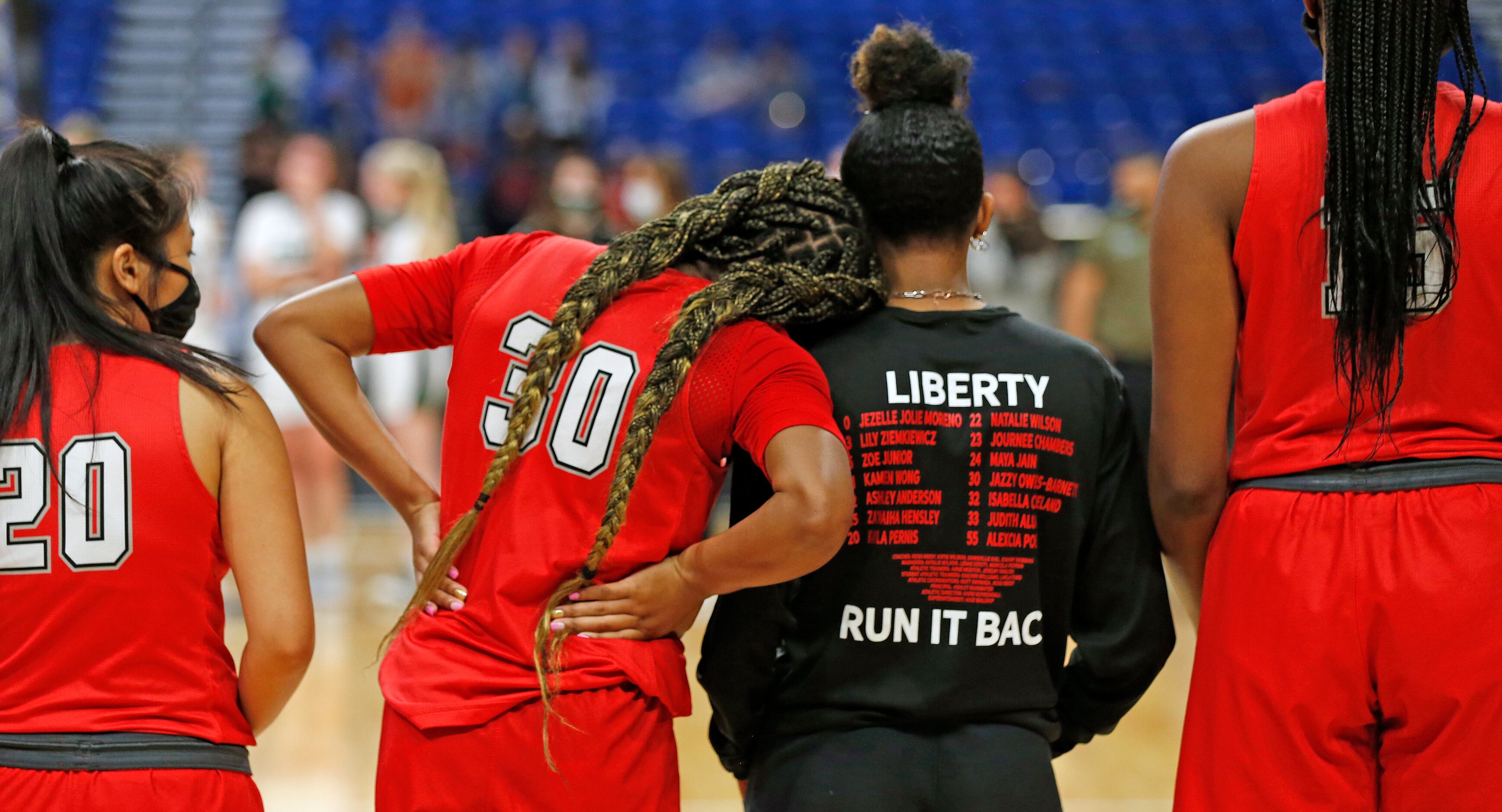 Frisco Liberty Jazzy Owens-Barnett #30 is consoled by Frisco Liberty Zoe Junior #5 after...
