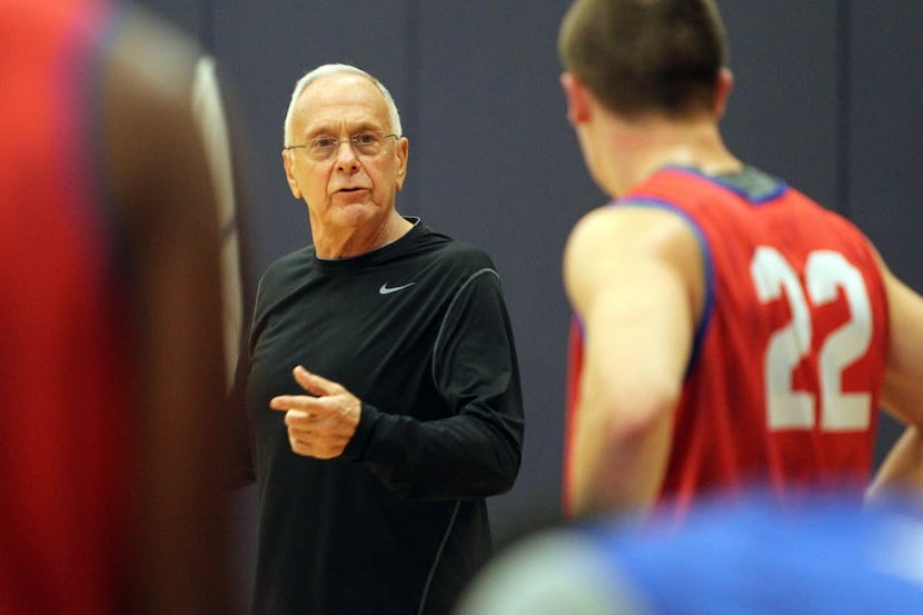 New SMU head basketball coach Larry Brown talks with Brian Bernardi (22) at practice on...