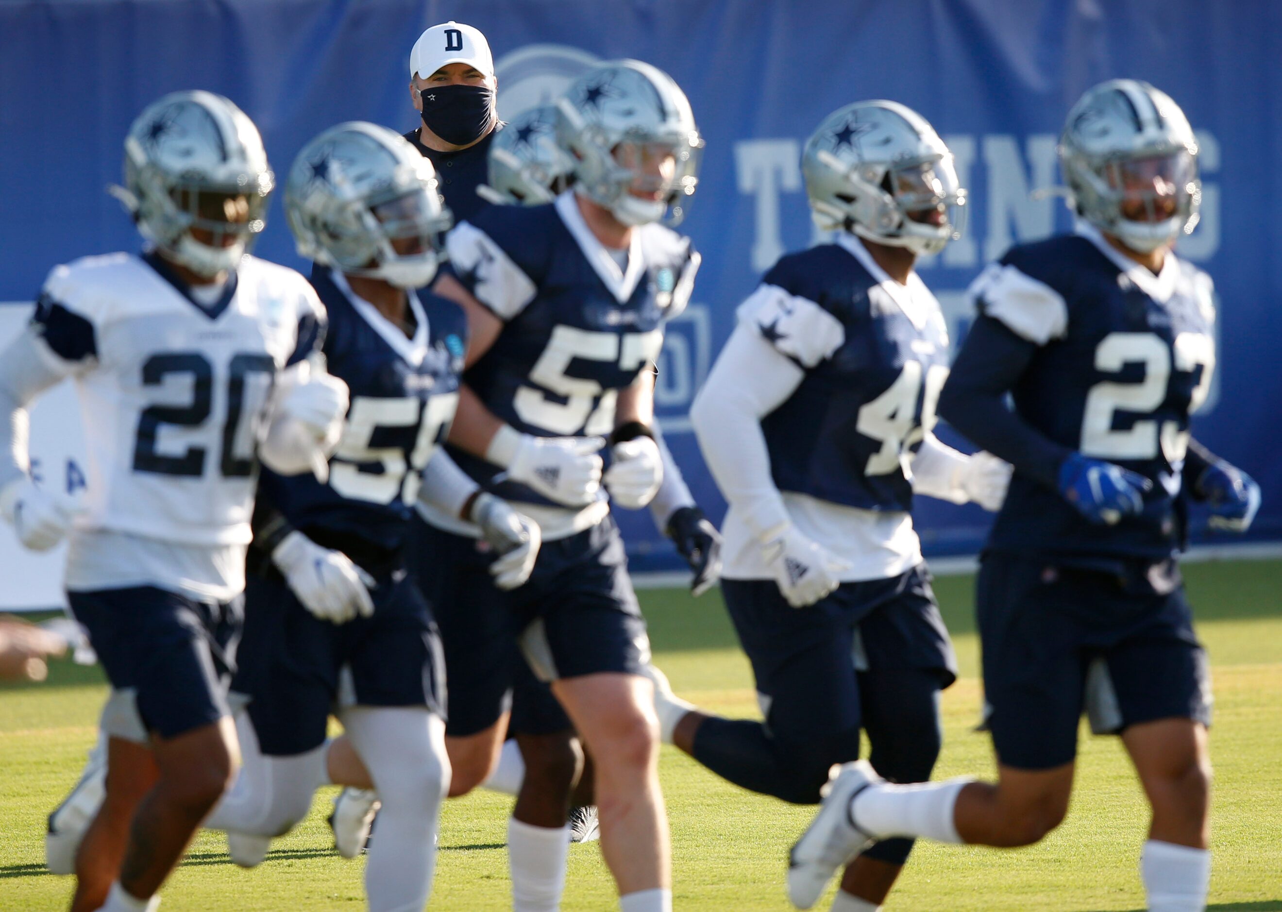 Dallas Cowboys head coach Mike McCarthy watches the team practice during the first day of...