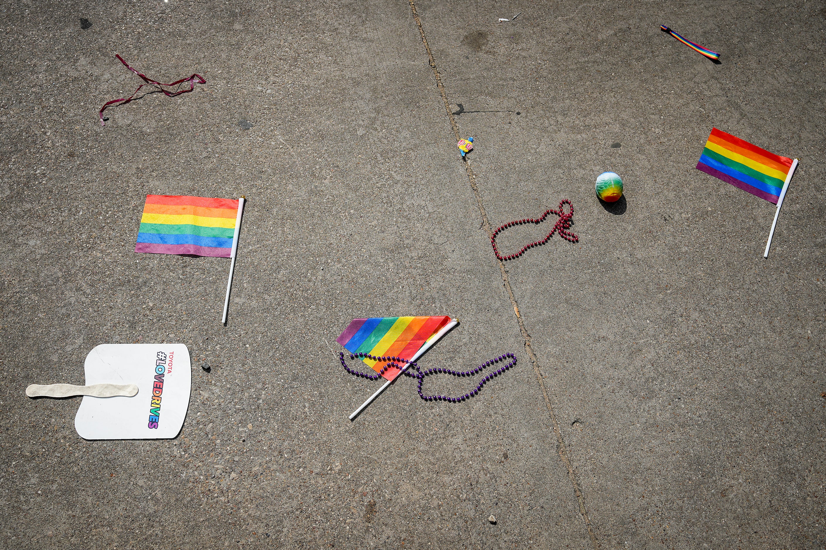 Pride flags and throws remain on the parade route after the annual Alan Ross Texas Freedom...