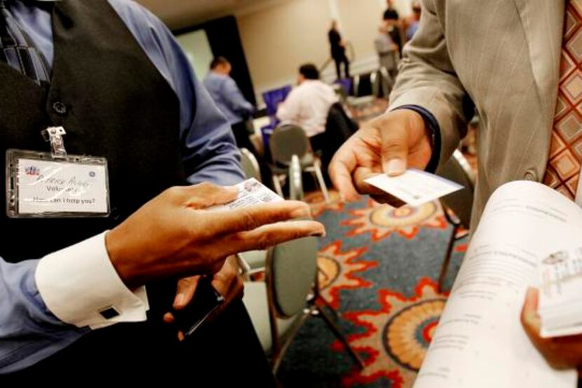 
Business cards changed hands at a job fair and career development seminar Friday in Dallas...
