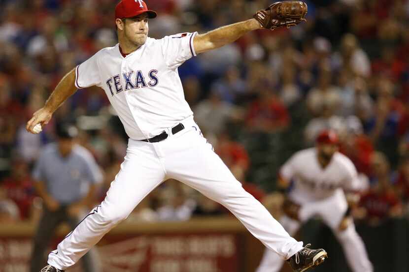Texas Rangers relief pitcher Ross Ohlendorf (51) pitches in a game against the Detroit...