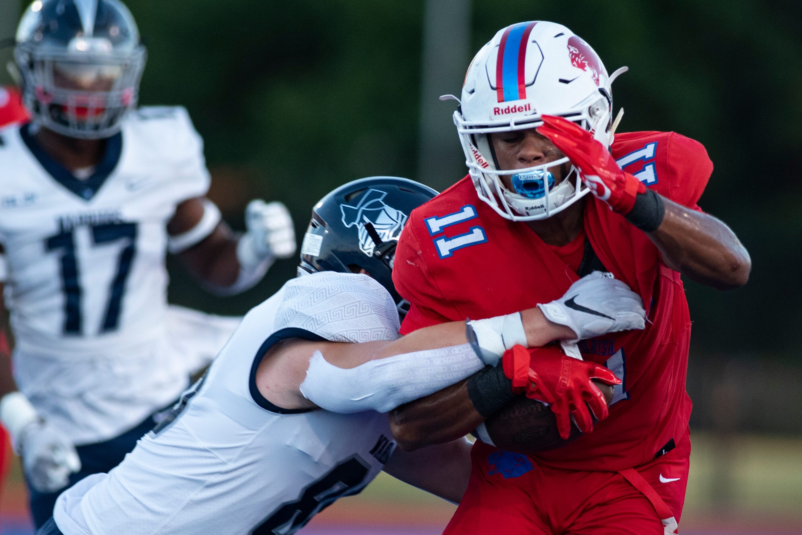 Argyle Liberty Christian sophomore Alex Caddell (88) tackles Parish Episcopal senior Noah...