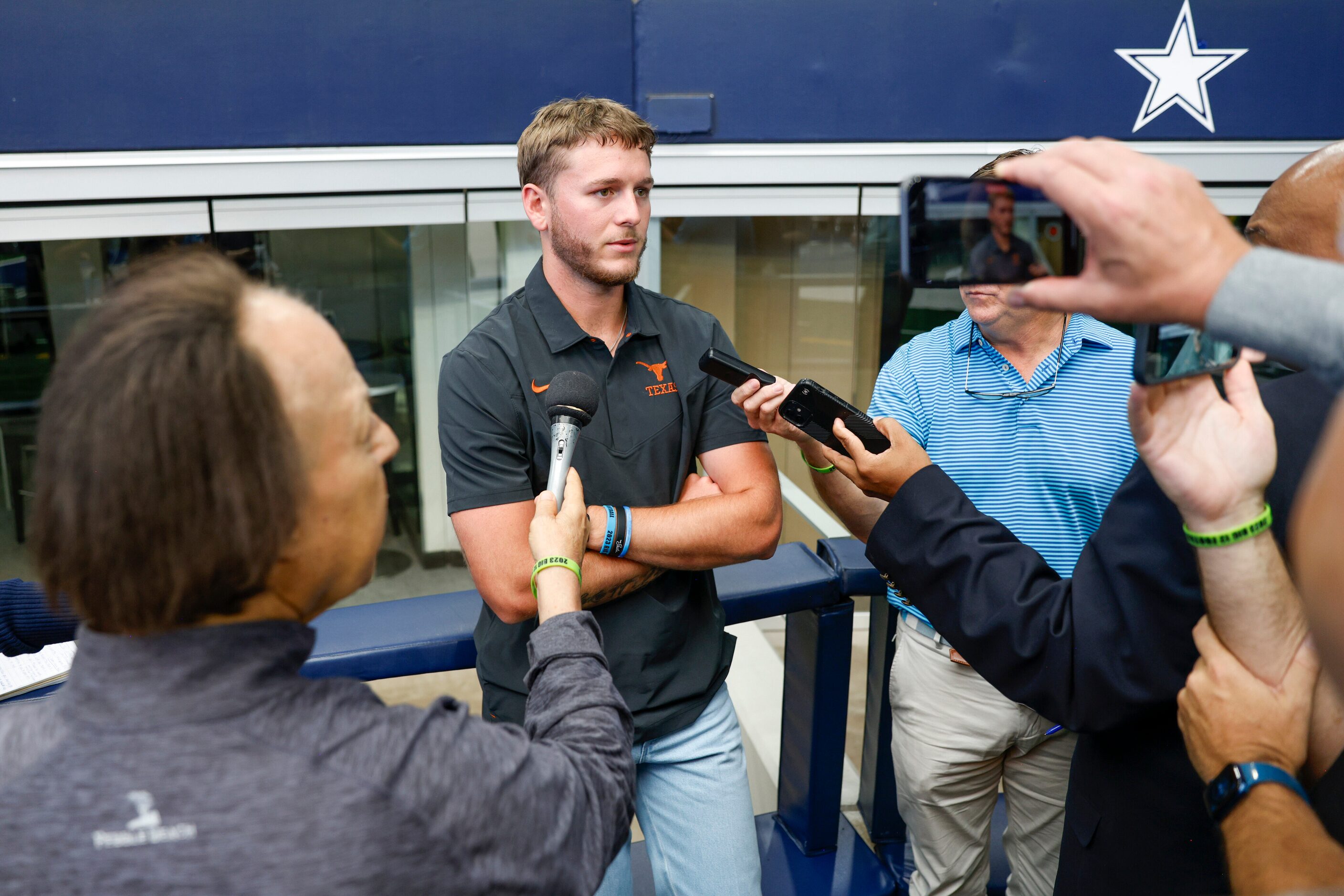 Texas quarterback Quinn Ewers speaks with reporters during the Big 12 Media Days at AT&T...