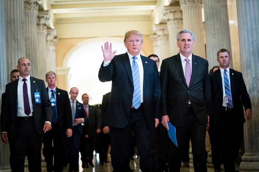 President Donald Trump walks with House Major­ity Leade­r Kevin McCar­thy (R-Ca­lif.) after...