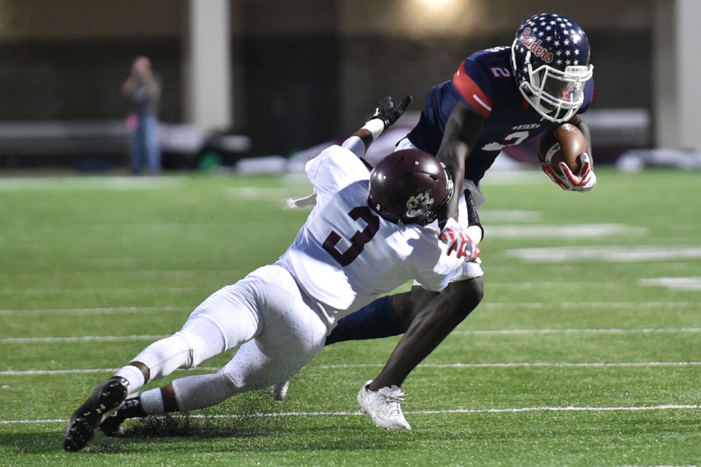 Ryan junior wide receiver Gabriel Douglas (2) makes the catch and runs the ball, while...