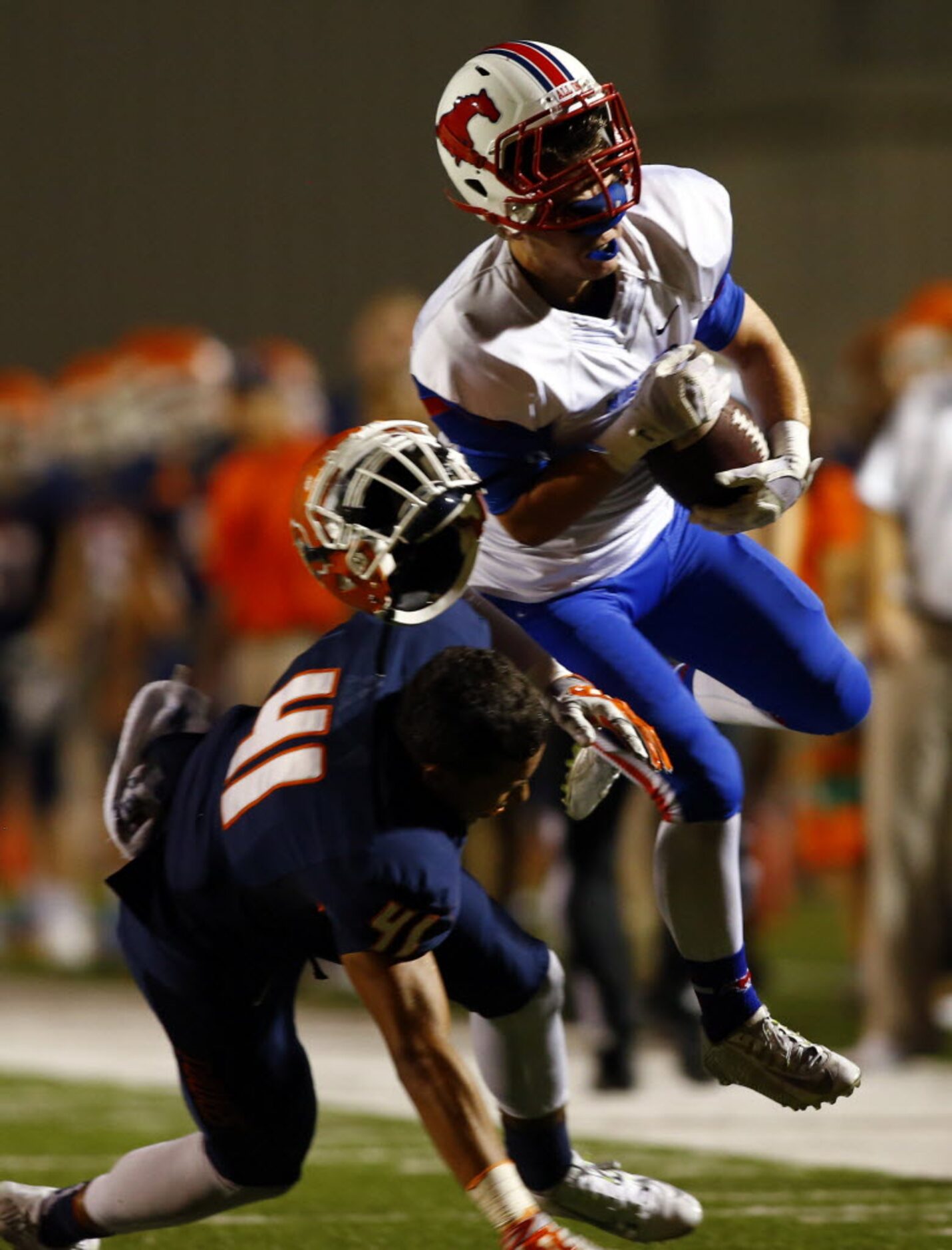 TXHSFB Richardson Pearce wide receiver Spencer Mandell (4) is hit hard by McKinney North...