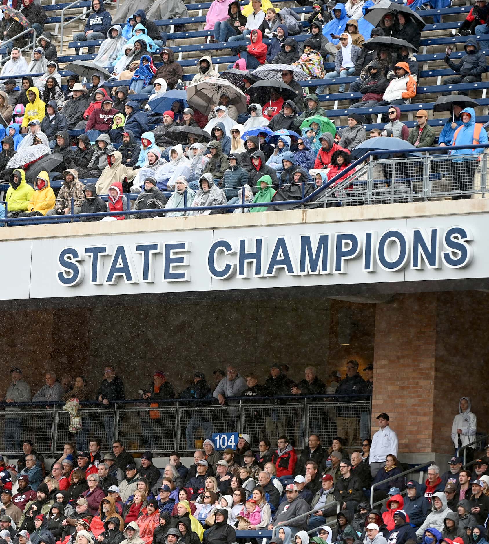 Allen fans watch in the rain the first half of Class 6A Division I Region I semifinal...