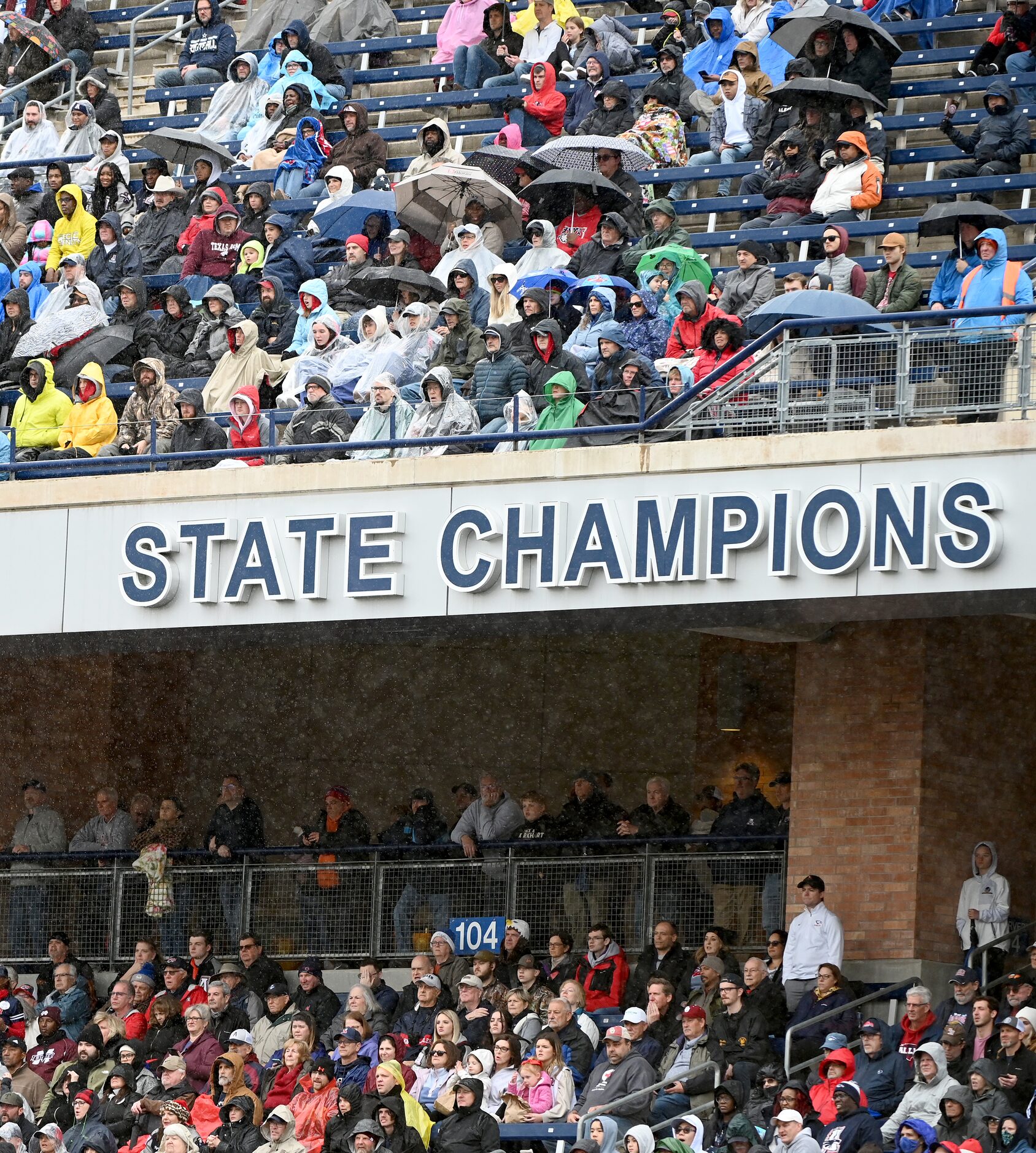 Allen fans watch in the rain the first half of Class 6A Division I Region I semifinal...