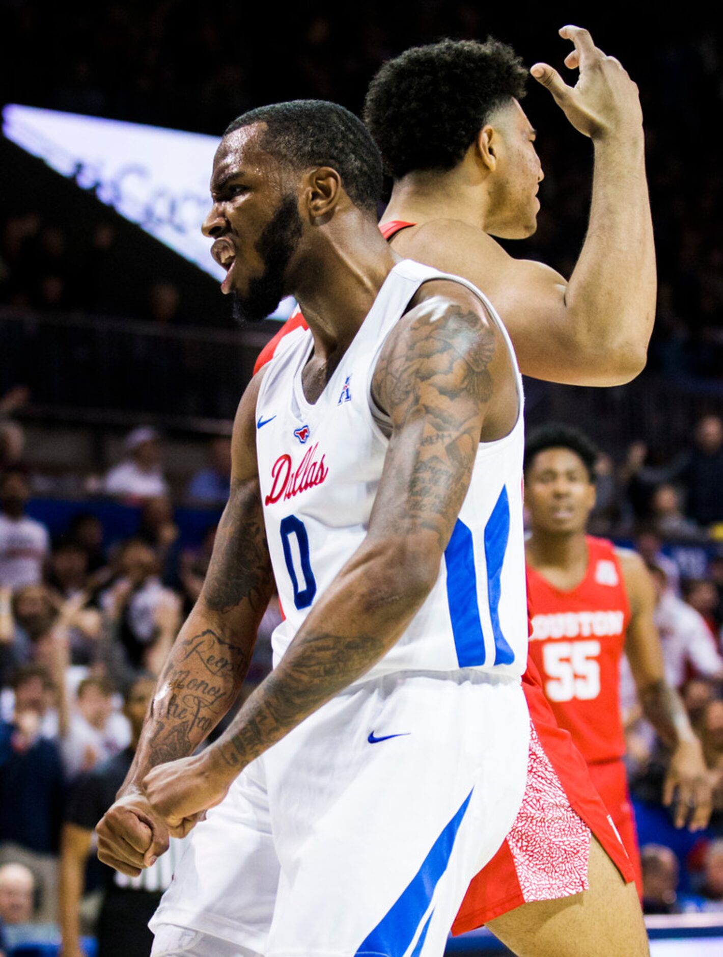 Southern Methodist Mustangs guard Tyson Jolly (0) celebrates a dunk during the second half...