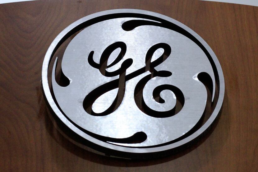 FILE - In this Thursday, Jan. 16, 2014, file photo, a General Electric logo is displayed at...
