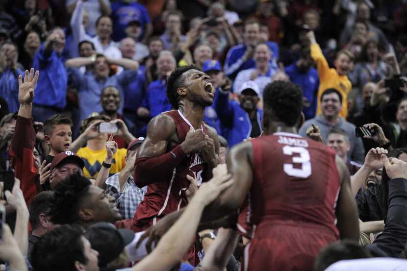 KANSAS CITY, MO - MARCH 11: Buddy Hield #24 of the Oklahoma Sooners celebrates with fans...