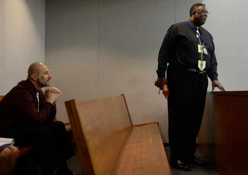 
Court coordinator Mario Love (right) and Adrian Valdez watch while Judge George Ashford...