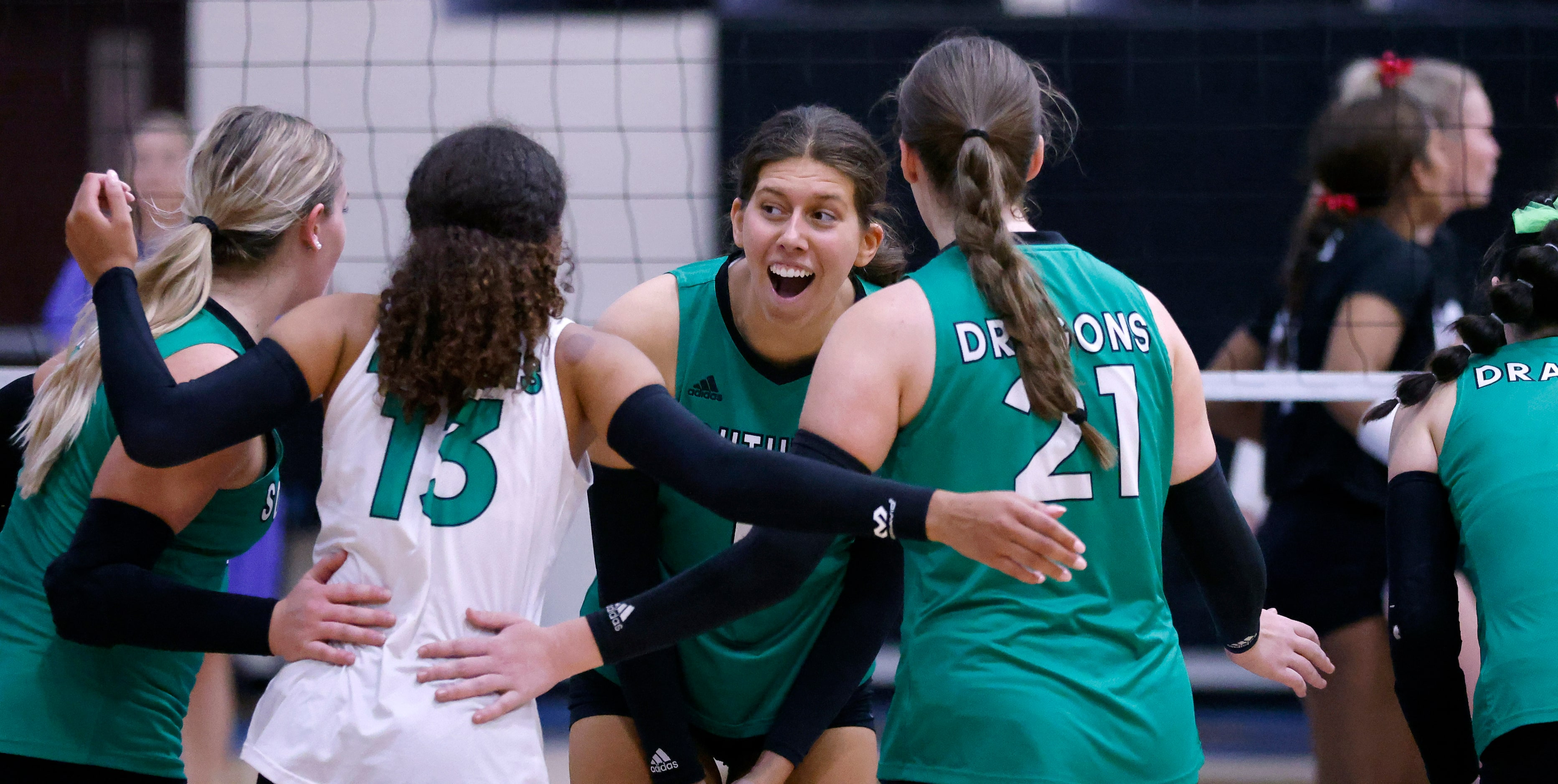 Southlake Carroll’s Tavlor Starr (second from right) celebrates a point against Trophy Club...