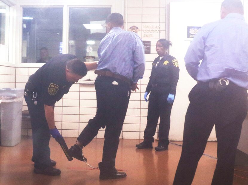 Wesley Mathews is processed after being transferred from the Richardson jail to the Lew...