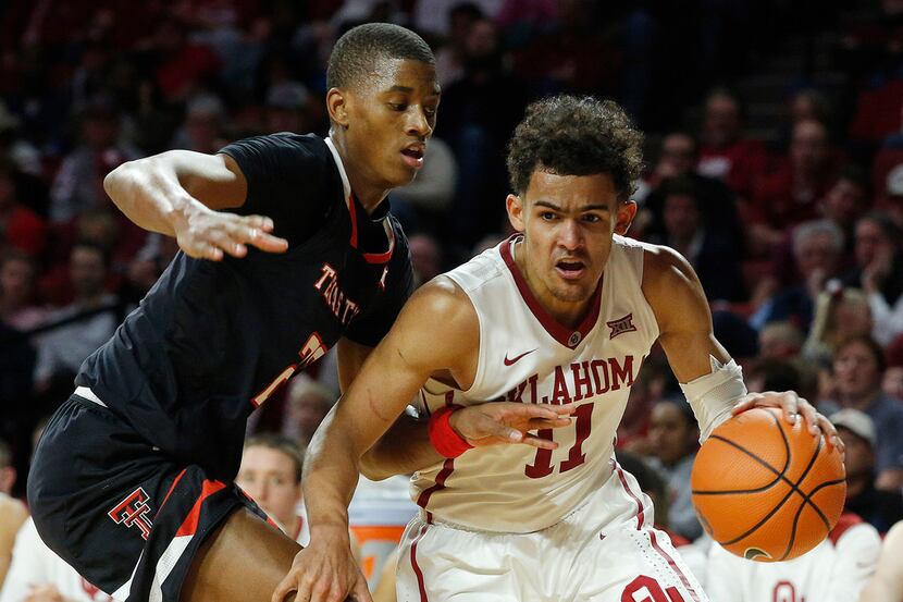 Oklahoma's Trae Young (11) drives the ball past Texas Tech's Jarrett Culver (23) during the...