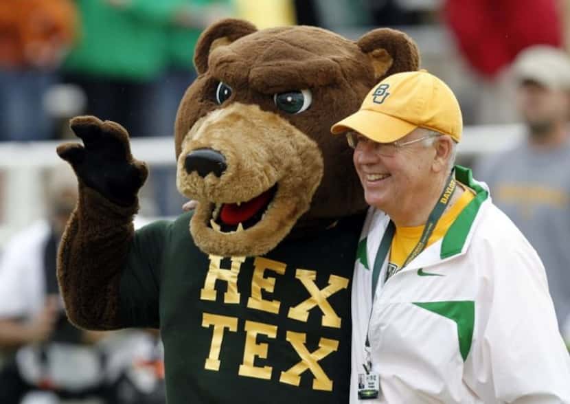Ken Starr, then Baylor's president, with the school's mascot before a football game between...