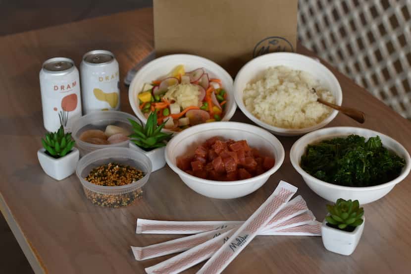 Malibu Poke offers family meal packs that include a choice of meat, sushi rice, kale, a bowl...