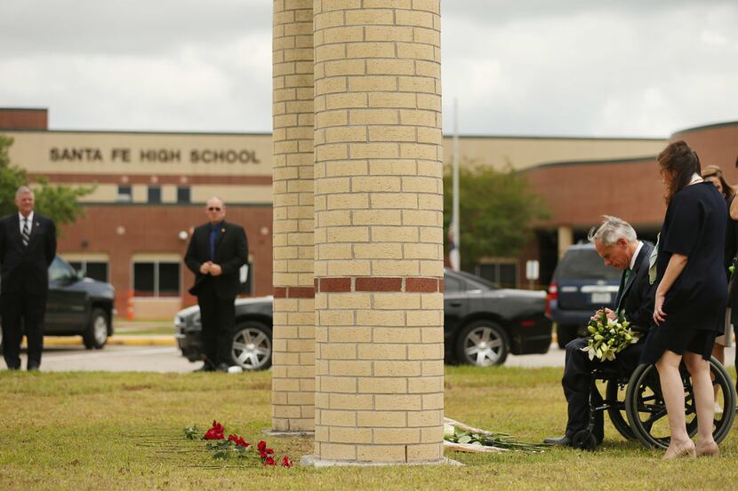 Texas governor Greg Abbott observed a moment of silence in May at Santa Fe High School...
