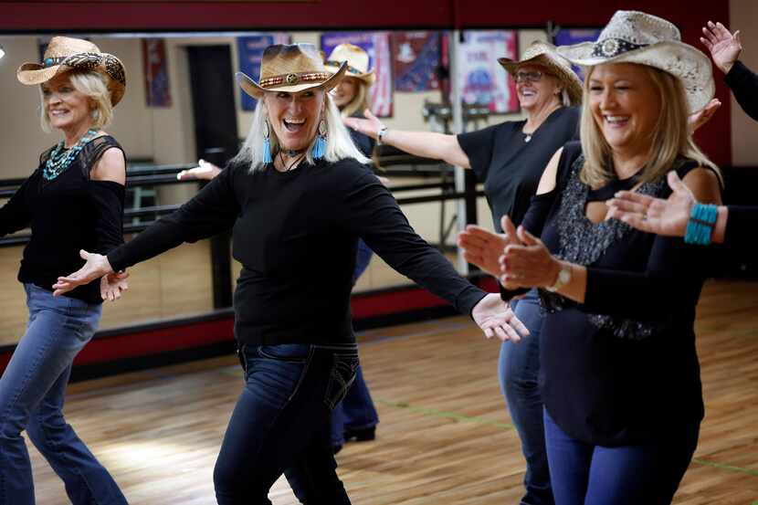 Texas Cool Line Dancers members Beverly Gallagher (front row from left), Vicki Woodlee and...