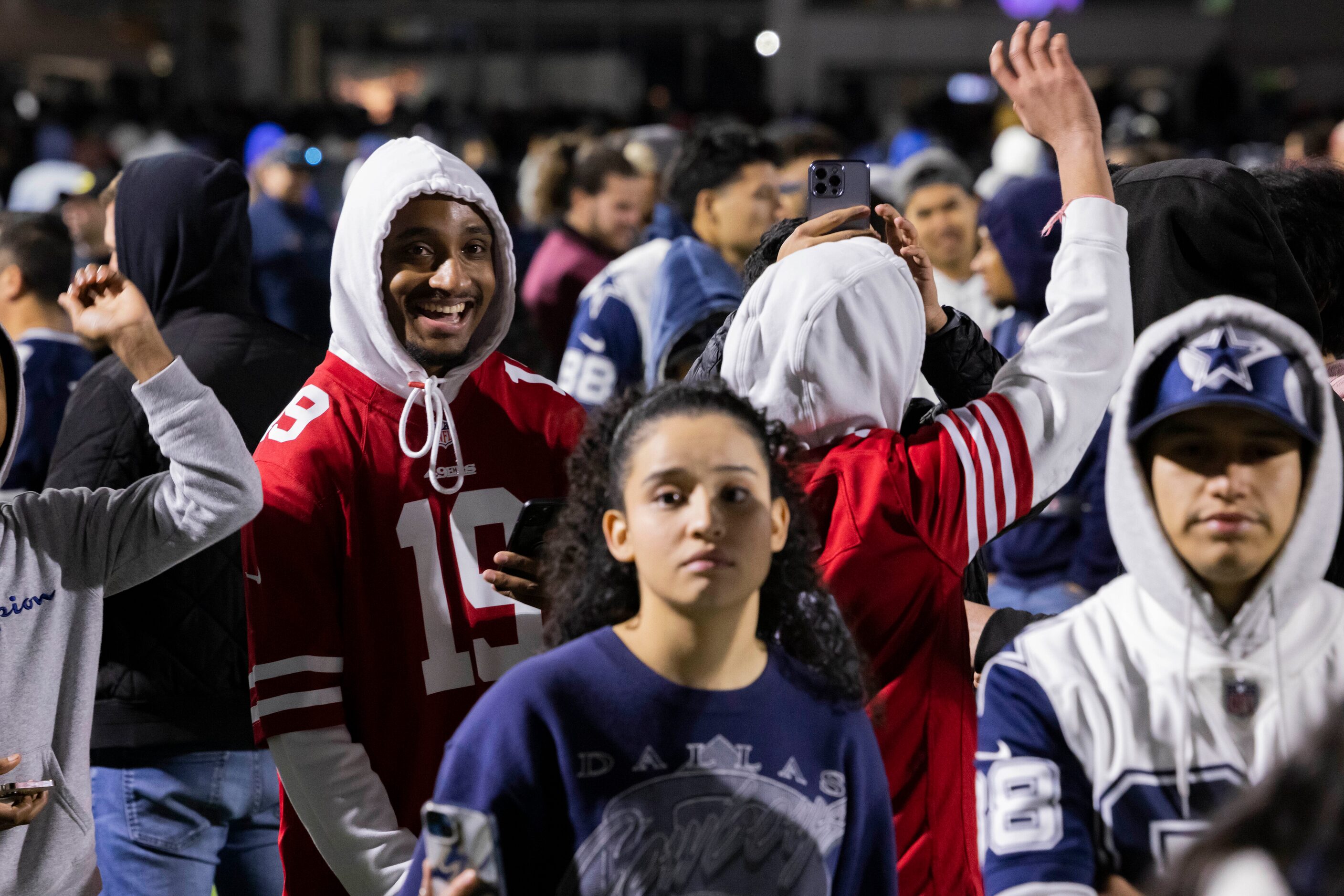 San Francisco 49ers fans celebrate as they beat the Dallas Cowboys in the final seconds of...