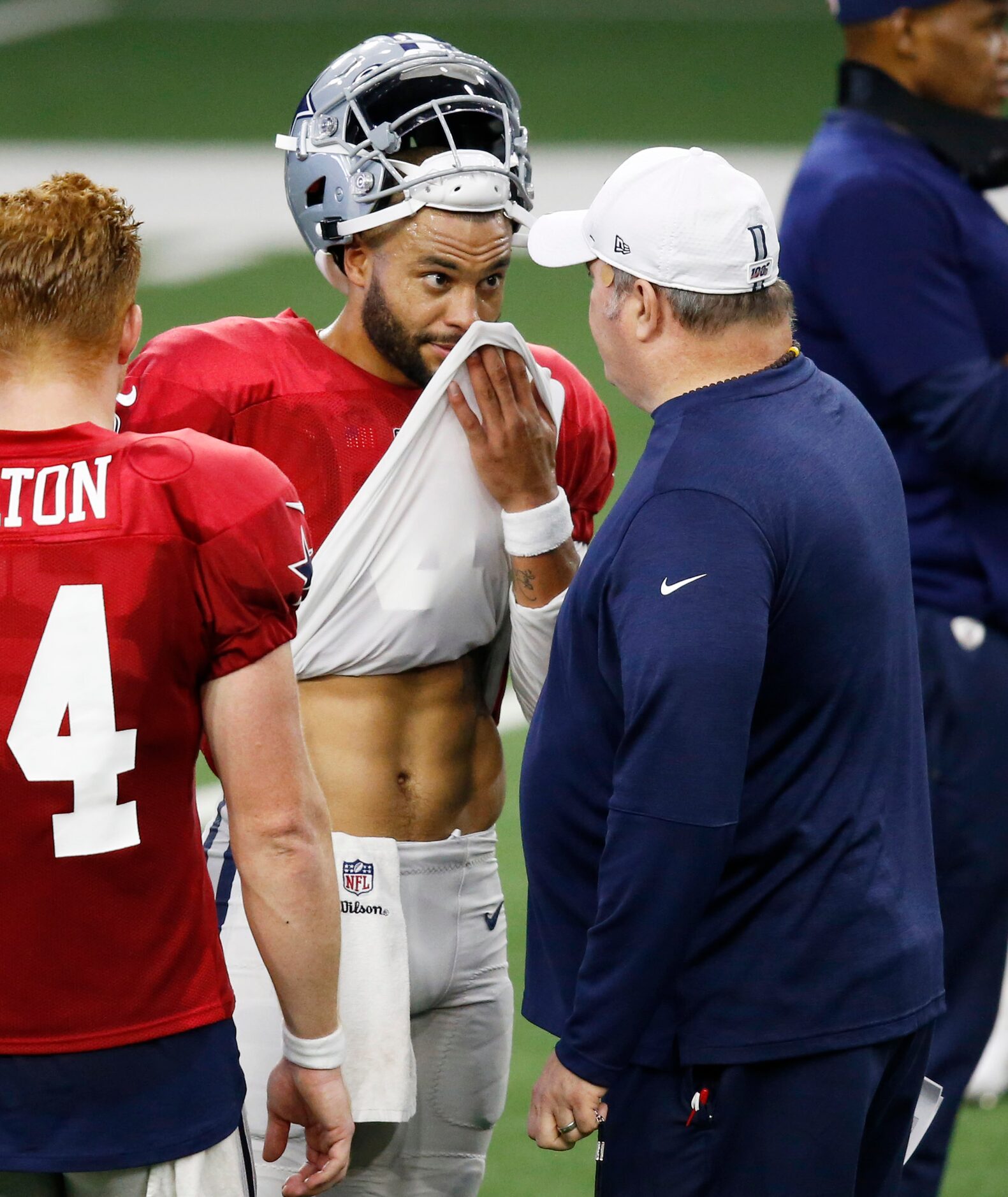 Dallas Cowboys head coach Mike McCarthy talks to Dallas Cowboys quarterback Dak Prescott (4)...