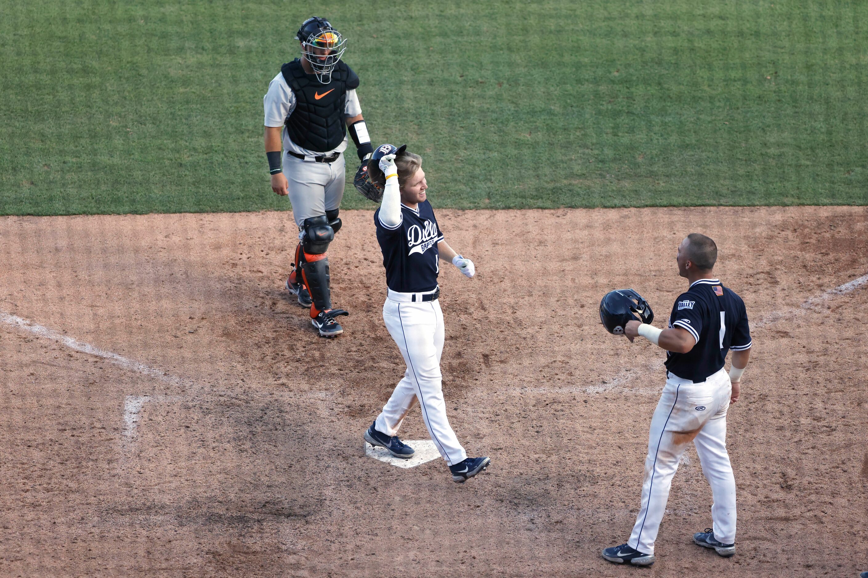 Dallas BaptistÕs River Town (14) celebrates with teammate Andres Sosa (1) as Oregon St....