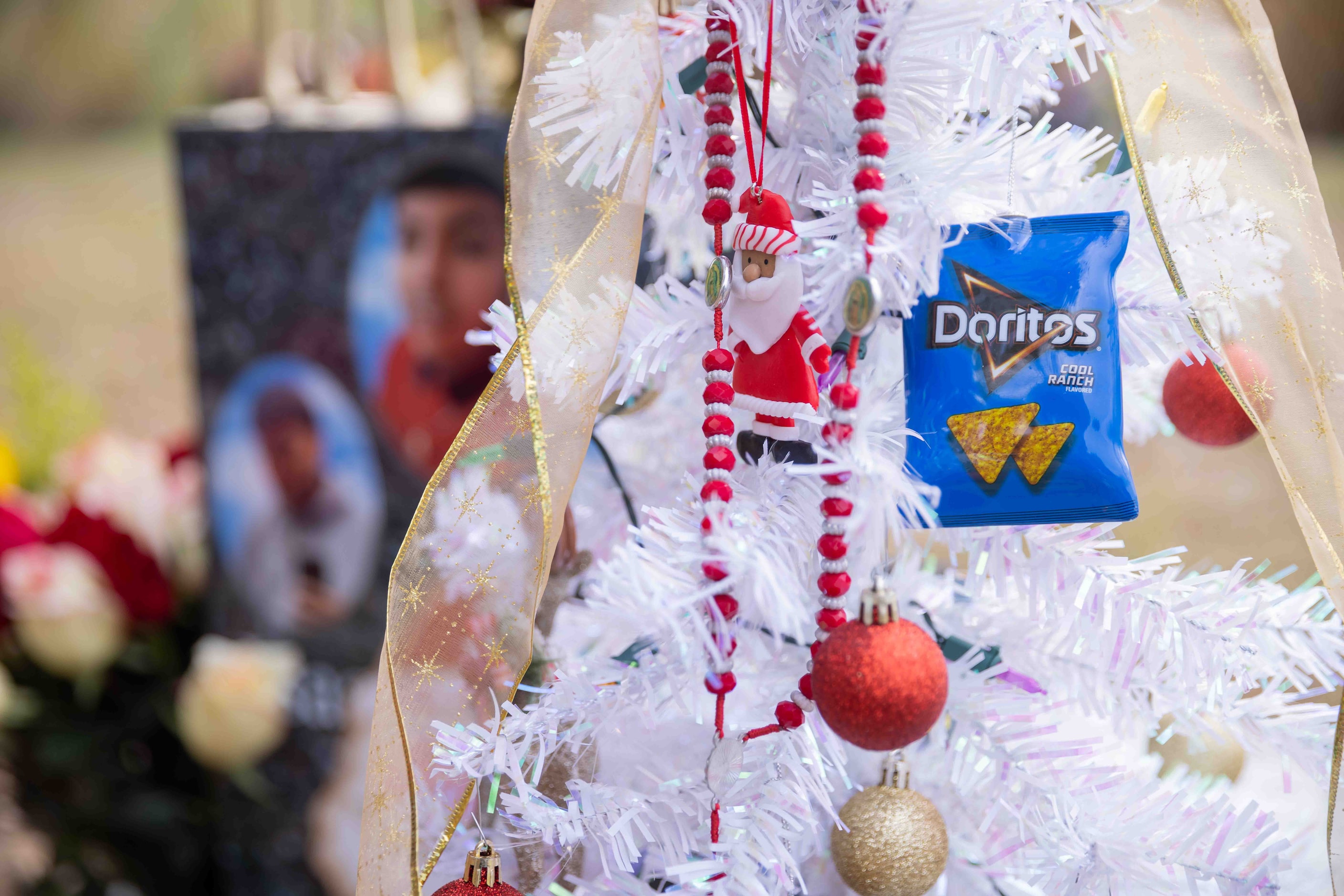 A Doritos Cool Ranch ornament on the Christmas tree at Isaac Aguirre’s gravesite at Grove...