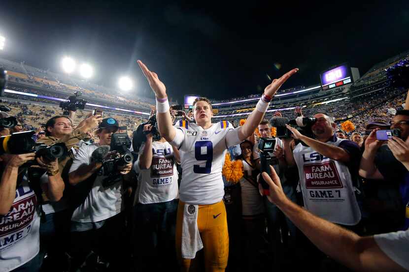 LSU quarterback Joe Burrow (9) gestures thanks to the student section after playing his last...