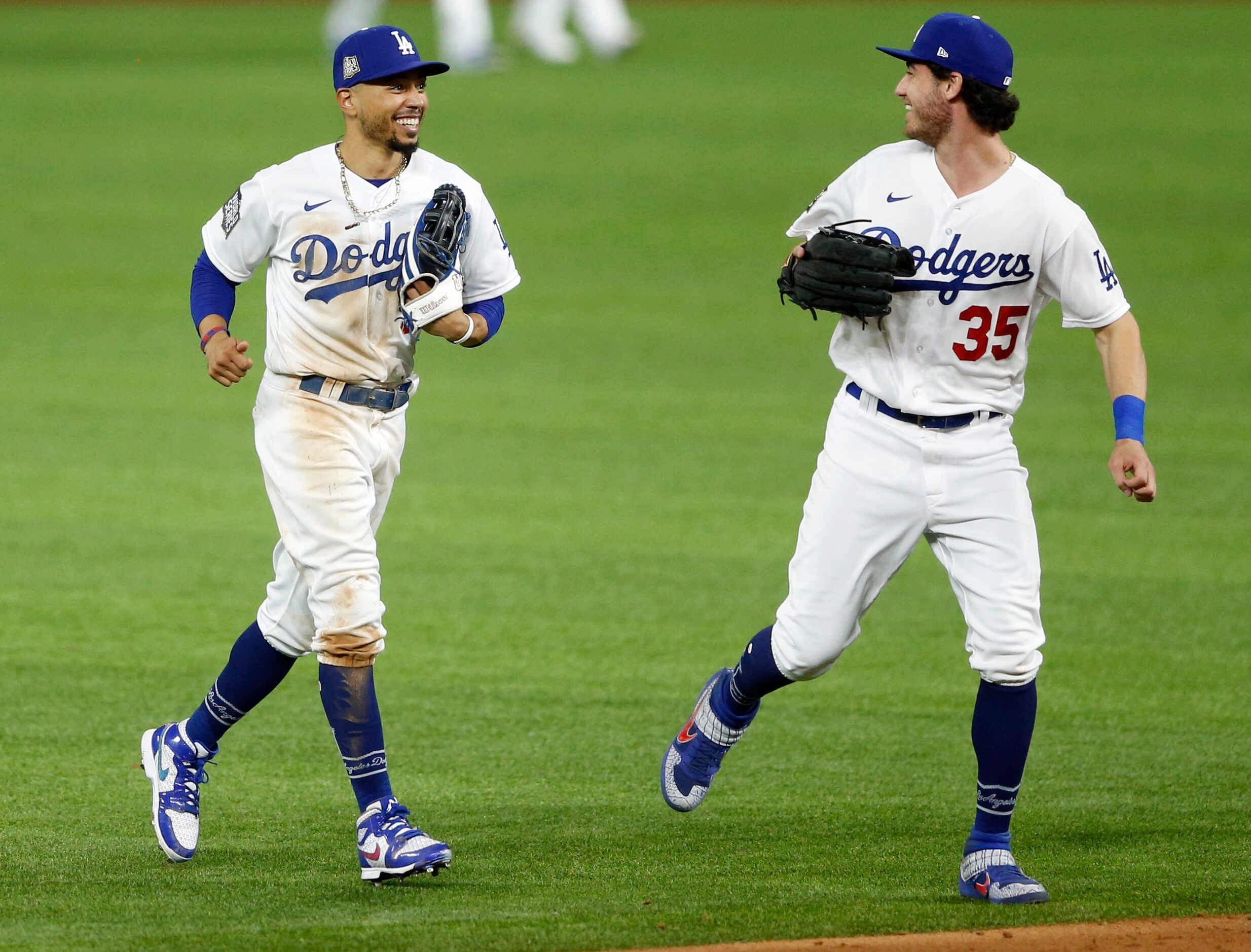 Los Angeles Dodgers right fielder Mookie Betts (50) and Los Angeles Dodgers center fielder...